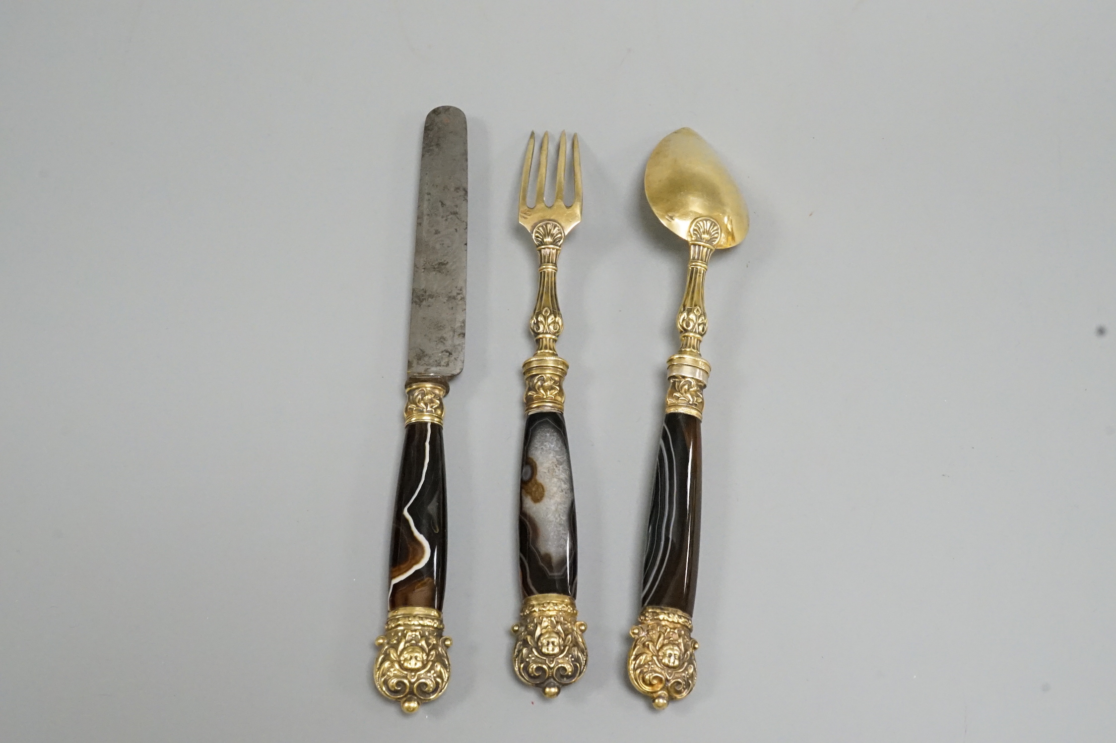A 19th century French gilt white metal and agate mounted three piece cutlery set, knife 20.5cm.